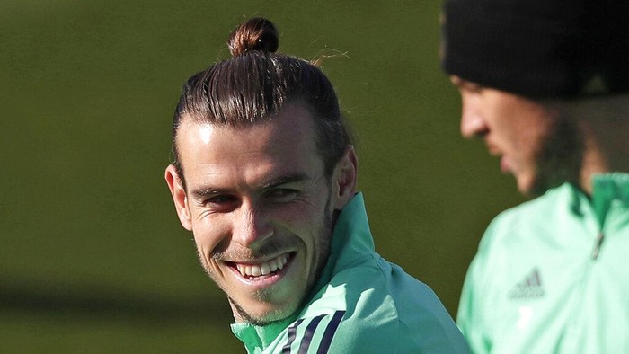 FILE - In this Monday, Nov. 25, 2019 file photo, Real Madrids Gareth Bale takes part in a training session at the teams Valdebebas training ground in Madrid, Spain. Out of favor at Real Madrid, Gareth Bale is hoping to secure a return to Premier League club Tottenham. Bales agent, Jonathan Barnett, confirmed to The Associated Press that he is in talks with Tottenham Hotspur. (AP Photo/Manu Fernandez, File)