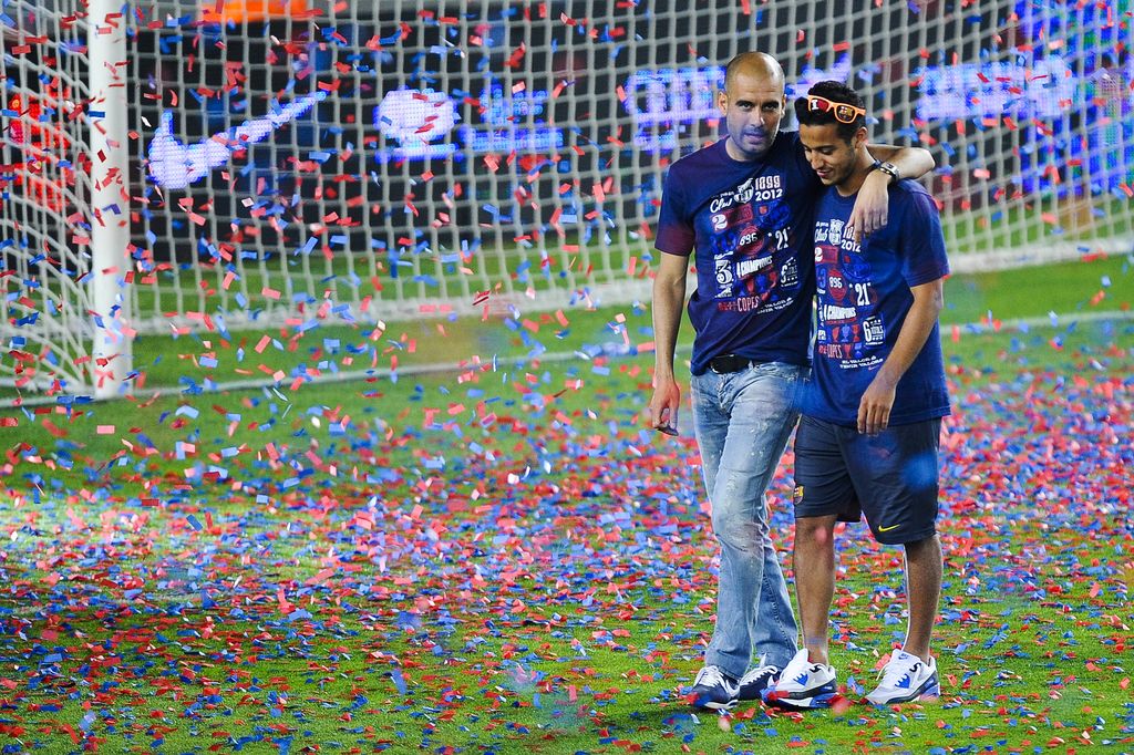 BARCELONA, SPAIN - MAY 26:  Head coach Josep Guardiola of FC Barcelona chats with Thiago Alcantara of FC Barcelona during the FC Barcelona celebrations following the club's victory of the Copa del Rey (King's Cup) at Camp Nou on May 26, 2012 in Barcelona, Spain.  (Photo by David Ramos/Getty Images)