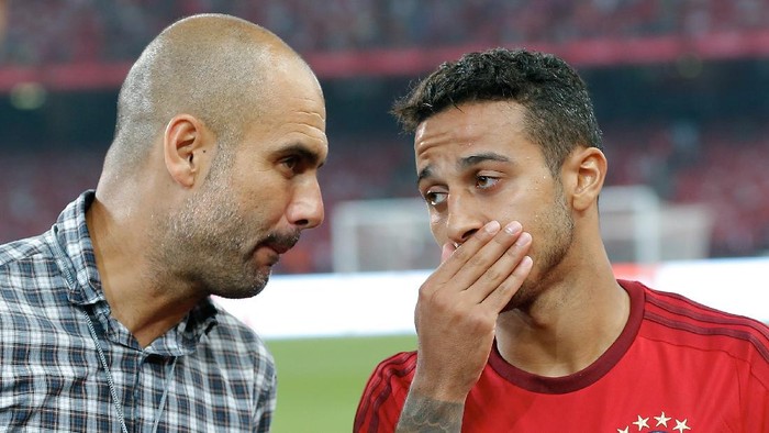 BEIJING, CHINA - JULY 18:  Josep Guardiola, head coach of FC Bayern Muenchen talks to his player Thiago during the international friendly match between FC Bayern Muenchen and Valencia FC during the Audi Football Summit Beijing 2015 at National Stadium on July 18, 2015 in Beijing, China.  (Photo by Lintao Zhang/Getty Images)