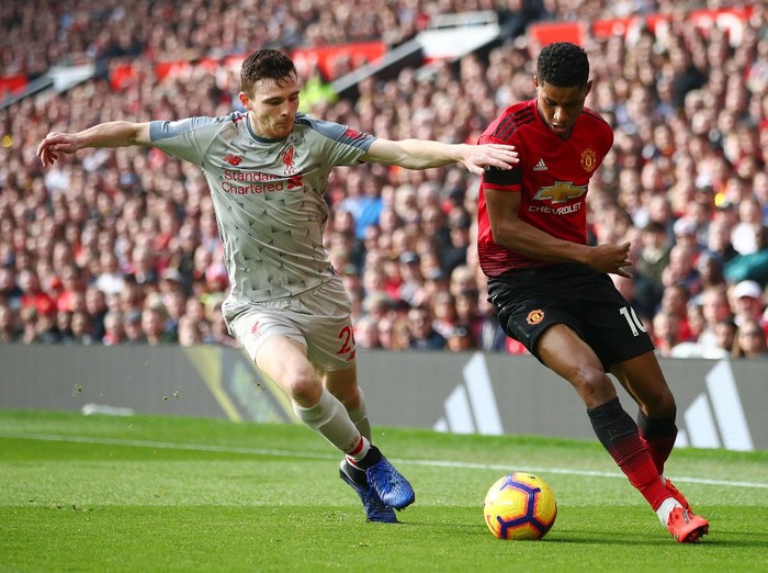 MANCHESTER, ENGLAND - FEBRUARY 24:  Marcus Rashford of Manchester United battles for possession with Andy Robertson of Liverpool during the Premier League match between Manchester United and Liverpool FC at Old Trafford on February 24, 2019 in Manchester, United Kingdom.  (Photo by Clive Brunskill/Getty Images)