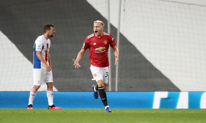 MANCHESTER, ENGLAND - SEPTEMBER 19: Donny Van De Beek of Manchester United celebrates after scoring his teams first goal  during the Premier League match between Manchester United and Crystal Palace at Old Trafford on September 19, 2020 in Manchester, England. (Photo by Martin Rickett - Pool/Getty Images)