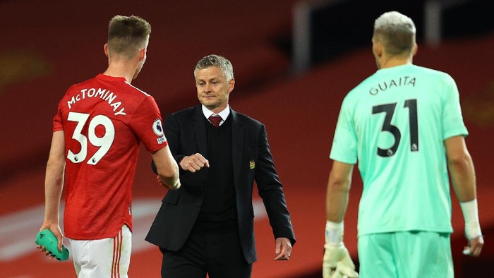 MANCHESTER, ENGLAND - SEPTEMBER 19: Ole Gunnar Solskjaer, Manager of Manchester United with Scott McTominay of Manchester United following the Premier League match between Manchester United and Crystal Palace at Old Trafford on September 19, 2020 in Manchester, England. (Photo by Richard Heathcote/Getty Images )