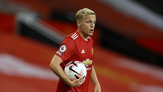 Manchester United's Donny van de Beek celebrates scoring their first goal during the English Premier League soccer match between Manchester United and Crystal Palace at the Old Trafford stadium in Manchester, England, Saturday, Sept. 19, 2020. (Richard Heathcote/Pool via AP)
