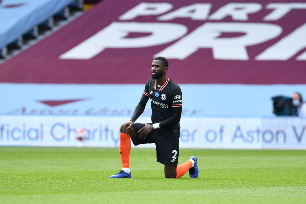 BIRMINGHAM, ENGLAND - JUNE 21: Antonio Rudiger of Chelsea takes a knee in support of the Black Lives Matter movement  during the Premier League match between Aston Villa and Chelsea FC at Villa Park on June 21, 2020 in Birmingham, England. Football Stadiums around Europe remain empty due to the Coronavirus Pandemic as Government social distancing laws prohibit fans inside venues resulting in all fixtures being played behind closed doors. (Photo by Justin Tallis/Pool via Getty Images)