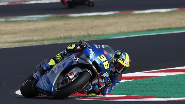 MotoGP rider Joan Mir of Spain takes a curve during the Emilia Romagna Motorcycle Grand Prix at the Misano circuit in Misano Adriatico, Italy, Sunday, Sept. 20, 2020. (AP Photo/Antonio Calanni)