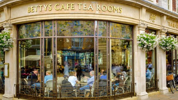 York, England - July 5, 2014: Betty's Cafe Tea Rooms, busy full of customers. At 6-8 St Helens Square, York, North Yorkshire.