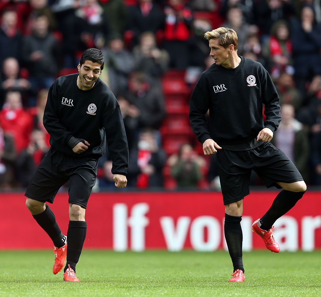LIVERPOOL, ENGLAND - MARCH 29: Luis Suarez and Fernando Torres of the Gerrard XI warm up ahead of the Liverpool All-Star Charity match at Anfield on March 29, 2015 in Liverpool, England. (Photo by Chris Brunskill/Getty Images)