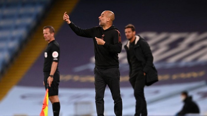 MANCHESTER, ENGLAND - SEPTEMBER 24: Pep Guardiola, Manager of Manchester City gives his team instructions during the Carabao Cup third round match between Manchester City and AFC Bournemouth at Etihad Stadium on September 24, 2020 in Manchester, England. Football Stadiums around Europe remain empty due to the Coronavirus Pandemic as Government social distancing laws prohibit fans inside venues resulting in fixtures being played behind closed doors. (Photo by Laurence Griffiths/Getty Images)