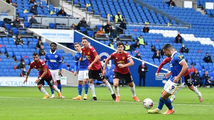 BRIGHTON, ENGLAND - SEPTEMBER 26: Neal Maupay of Brighton and Hove Albion scores a penalty for his teams first goal during the Premier League match between Brighton & Hove Albion and Manchester United at American Express Community Stadium on September 26, 2020 in Brighton, England. Sporting stadiums around the UK remain under strict restrictions due to the Coronavirus Pandemic as Government social distancing laws prohibit fans inside venues resulting in games being played behind closed doors. (Photo by Glyn Kirk - Pool/Getty Images)