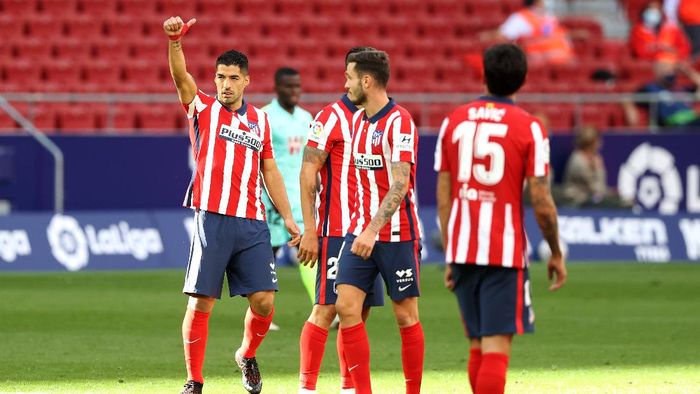 Luis Suarez Atletico Madrid MADRID, SPAIN - SEPTEMBER 27: Luis Suarez of Atletico de Madrid celebrates after scoring his sides fifth goal during the La Liga Santander match between Atletico de Madrid and Granada CF at Estadio Wanda Metropolitano on September 27, 2020 in Madrid, Spain. Football Stadiums around Europe remain empty due to the Coronavirus Pandemic as Government social distancing laws prohibit fans inside venues resulting in fixtures being played behind closed doors. (Photo by Angel Martinez/Getty Images)
