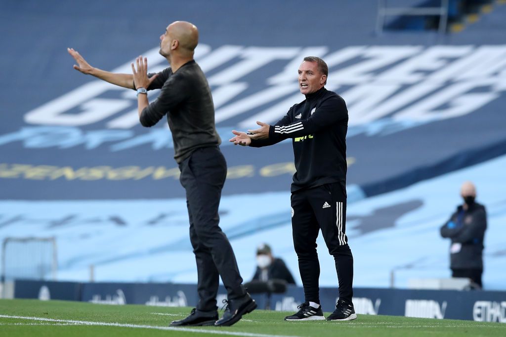 MANCHESTER, ENGLAND - SEPTEMBER 27: Pep Guardiola, Manager of Manchester City interacts with Brendan Rogers, Manager of Leicester City following the Premier League match between Manchester City and Leicester City at Etihad Stadium on September 27, 2020 in Manchester, England. Sporting stadiums around the UK remain under strict restrictions due to the Coronavirus Pandemic as Government social distancing laws prohibit fans inside venues resulting in games being played behind closed doors. (Photo by Catherine Ivill/Getty Images)