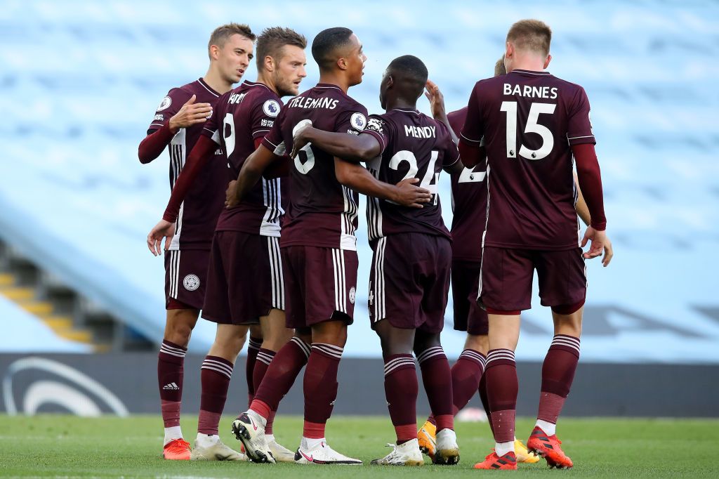 MANCHESTER, ENGLAND - SEPTEMBER 27: Jamie Vardy of Leicester City celebrates with teammates after scoring his sides first goal during the Premier League match between Manchester City and Leicester City at Etihad Stadium on September 27, 2020 in Manchester, England. Sporting stadiums around the UK remain under strict restrictions due to the Coronavirus Pandemic as Government social distancing laws prohibit fans inside venues resulting in games being played behind closed doors. (Photo by Martin Rickett - Pool/Getty Images )