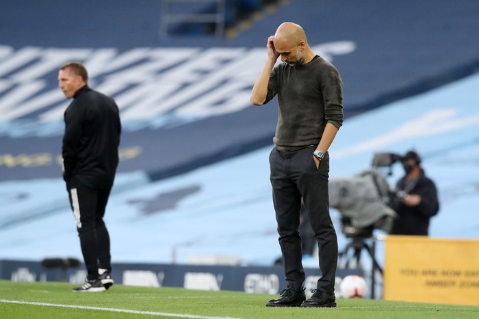 MANCHESTER, ENGLAND - SEPTEMBER 27: Pep Guardiola, Manager of Manchester City looks dejected during the Premier League match between Manchester City and Leicester City at Etihad Stadium on September 27, 2020 in Manchester, England. Sporting stadiums around the UK remain under strict restrictions due to the Coronavirus Pandemic as Government social distancing laws prohibit fans inside venues resulting in games being played behind closed doors. (Photo by Martin Rickett - Pool/Getty Images )