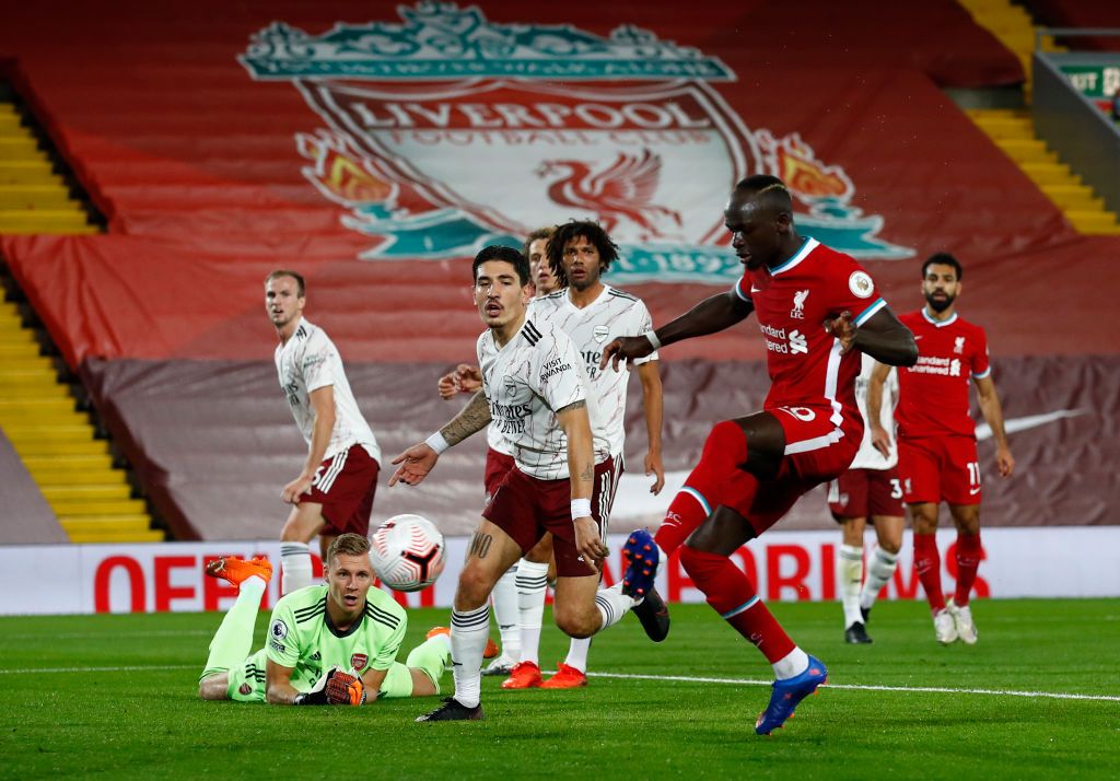 LIVERPOOL, ENGLAND - SEPTEMBER 28: Sadio Mane of Liverpool scores his sides first goal during the Premier League match between Liverpool and Arsenal at Anfield on September 28, 2020 in Liverpool, England. Sporting stadiums around the UK remain under strict restrictions due to the Coronavirus Pandemic as Government social distancing laws prohibit fans inside venues resulting in games being played behind closed doors. (Photo by Jason Cairnduff - Pool/Getty Images)