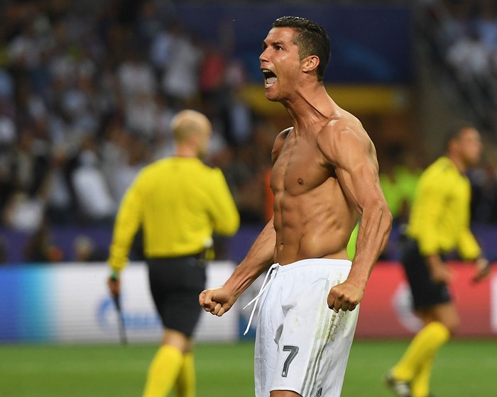 MILAN, ITALY - MAY 28:  Cristiano Ronaldo of Real Madrid celebrates scoring the winning penalty during the UEFA Champions League Final match between Real Madrid and Club Atletico de Madrid at Stadio Giuseppe Meazza on May 28, 2016 in Milan, Italy.  (Photo by Laurence Griffiths/Getty Images)