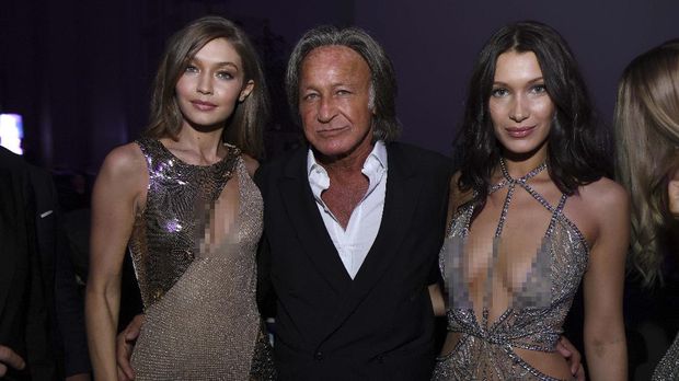 Mohamed Hadid, Gigi Hadid, Bella Hadid PARIS, FRANCE - NOVEMBER 30: (L-R) Gigi Hadid, Mohamed Hadid and Bella Hadid attend the Victoria's Secret After Party at the Grand Palais on November 30, 2016 in Paris, France. Dimitrios Kambouris/Getty Images for Victoria's Secret/AFP