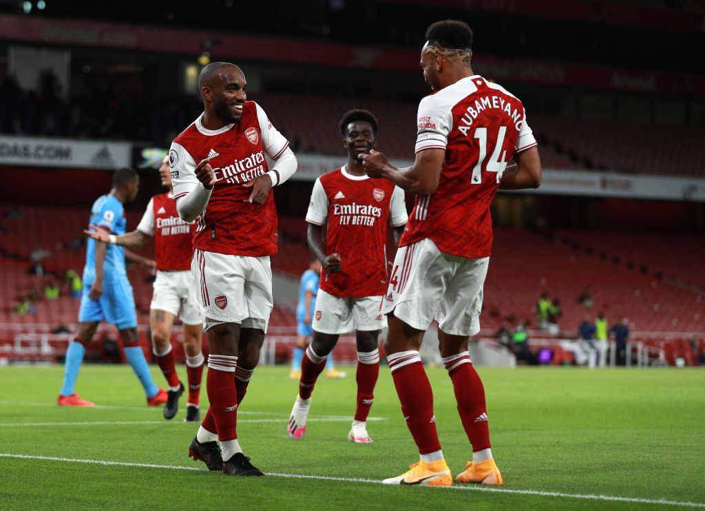 LONDON, ENGLAND - SEPTEMBER 19: Alexandre Lacazette of Arsenal celebrates with teammate Pierre-Emerick Aubameyang after scoring his team's first goal during the Premier League match between Arsenal and West Ham United at Emirates Stadium on September 19, 2020 in London, England. (Photo by Ian Walton - Pool/Getty Images)
