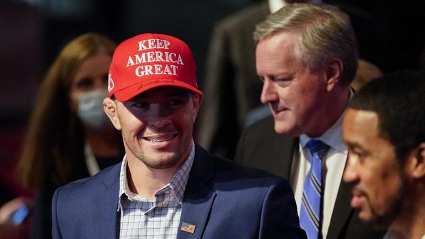 UFC fighter Colby Covington, left, and White Chief of Staff Mark Meadows, right, arriving at the first presidential debate Tuesday, Sept. 29, 2020, at Case Western University and Cleveland Clinic, in Cleveland, Ohio. (AP Photo/Julio Cortez)