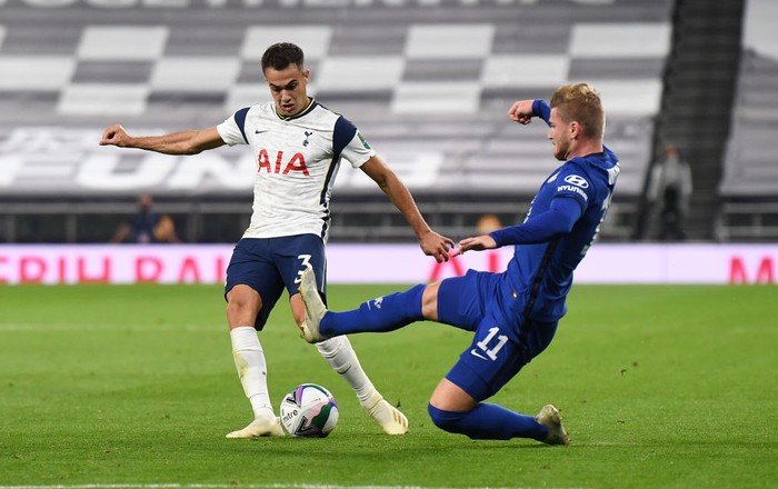 LONDON, ENGLAND - SEPTEMBER 29: Timo Werner of Chelsea tackles Sergio Reguilon of Tottenham Hotspur during the Carabao Cup fourth round match between Tottenham Hotspur and Chelsea at Tottenham Hotspur Stadium on September 29, 2020 in London, England. Football Stadiums around United Kingdom remain empty due to the Coronavirus Pandemic as Government social distancing laws prohibit fans inside venues resulting in fixtures being played behind closed doors. (Photo by Neil Hall - Pool/2020 Getty Images)