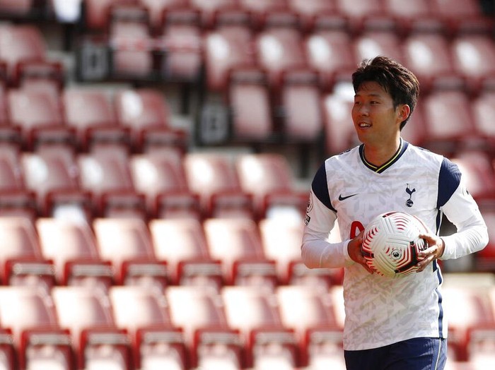 Tottenham's Son Heung-min holds the ball at the end of the English Premier League soccer match between Southampton and Tottenham Hotspur at St. Mary's Stadium in Southampton, England, Sunday, Sept. 20, 2020. (Andrew Boyers/Pool via AP)