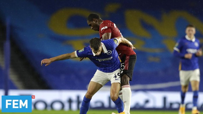 BRIGHTON, ENGLAND - SEPTEMBER 30: Jayson Molumby of Brighton and Hove Albion is challenged by Odion Ighalo of Manchester United during the Carabao Cup fourth round match between Brighton and Hove Albion and Manchester United at Amex Stadium on September 30, 2020 in Brighton, England. Football Stadiums around United Kingdom remain empty due to the Coronavirus Pandemic as Government social distancing laws prohibit fans inside venues resulting in fixtures being played behind closed doors. (Photo by Matt Dunham - Pool/Getty Images)