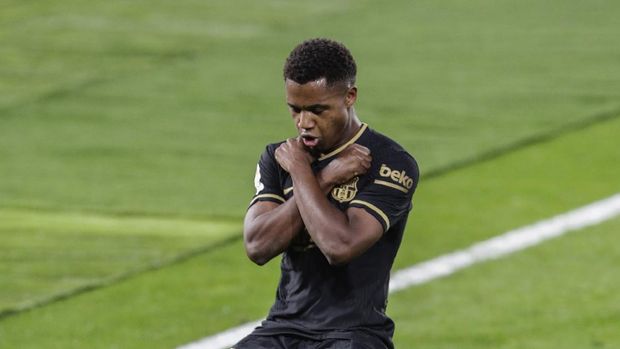 Barcelona's Ansu Fati celebrates after scoring the opening goal during the Spanish La Liga soccer match between RC Celta and FC Barcelona in Vigo, Spain, Thursday, Oct. 1, 2020. (AP Photo/Lalo R. Villar)