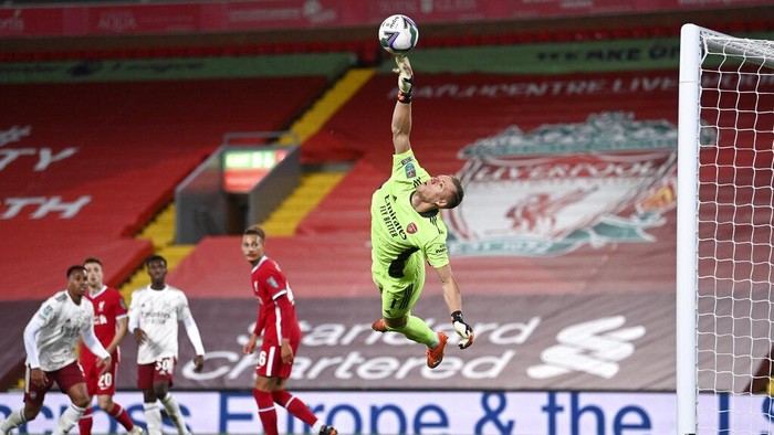 Arsenals goalkeeper Bernd Leno makes a save during the English League Cup fourth round soccer match between Liverpool and Arsenal at Anfield, Liverpool, England, Thursday, Oct. 1, 2020. (Laurence Griffiths/Pool via AP)