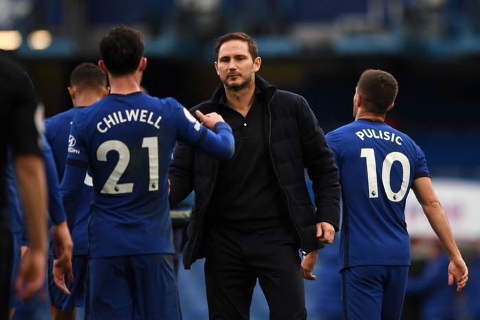LONDON, ENGLAND - OCTOBER 03: Frank Lampard, Manager of Chelsea and Ben Chilwell of Chelsea celebrate following their teams victory in the Premier League match between Chelsea and Crystal Palace at Stamford Bridge on October 03, 2020 in London, England. Sporting stadiums around the UK remain under strict restrictions due to the Coronavirus Pandemic as Government social distancing laws prohibit fans inside venues resulting in games being played behind closed doors. (Photo by Neil Hall - Pool/Getty Images)