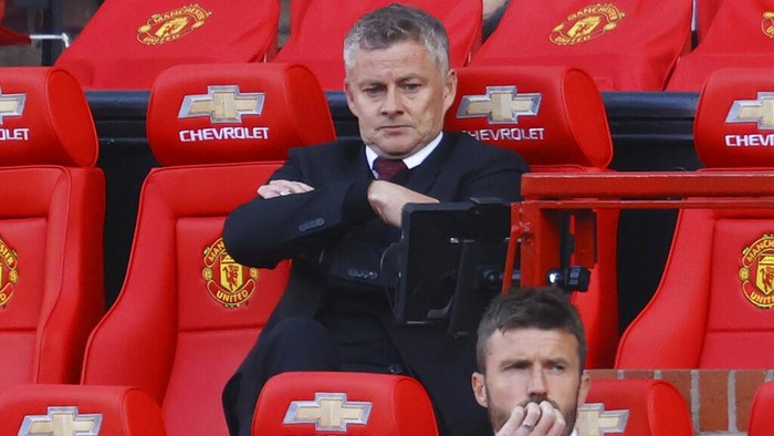 Manchester United manager Ole Gunnar Solskjaer appears dejected during the English Premier League soccer match between Manchester United and Crystal Palace at the Old Trafford stadium in Manchester, England, Saturday, Sept. 19, 2020. (Richard Heathcote/Pool via AP)