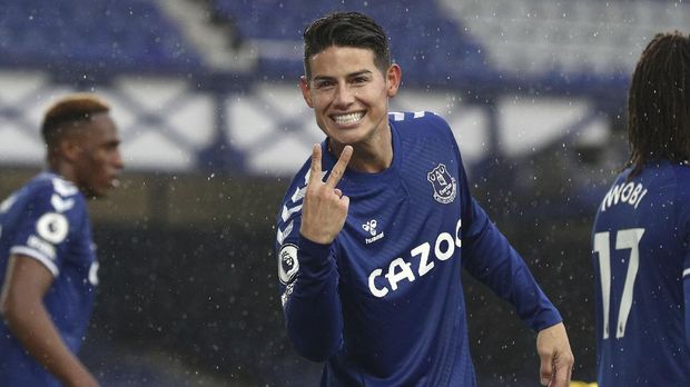 Everton's James Rodriguez celebrates after scoring his side's fourth goal during the English Premier League soccer match between Everton and Brighton at the Goodison Park stadium in Liverpool, England, Saturday, Oct. 3, 2020. (Jan Kruger/Pool via AP)
