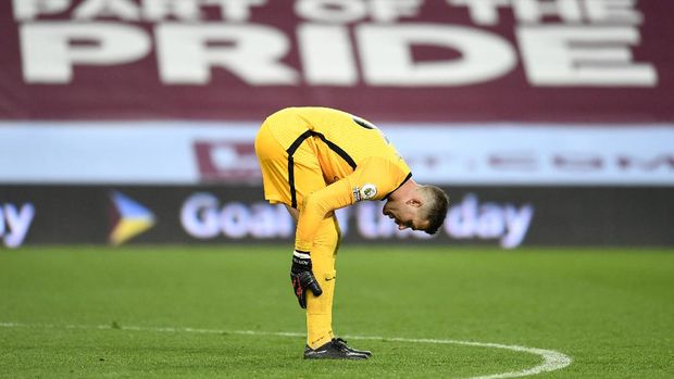 Liverpool's goalkeeper Adrian gestures after Aston Villa's Jack Grealish scores his side's sixth goal during the English Premier League soccer match between Aston Villa and Liverpool at the Villa Park stadium in Birmingham, England, Sunday, Oct. 4, 2020. (Peter Powell/Pool via AP)