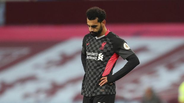 Liverpool's Mohamed Salah gestures after Aston Villa's Ross Barkley scores his side's fifth goal during the English Premier League soccer match between Aston Villa and Liverpool at the Villa Park stadium in Birmingham, England, Sunday, Oct. 4, 2020. (Cath Ivill/Pool via AP)