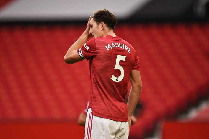 MANCHESTER, ENGLAND - OCTOBER 04: Harry Maguire of Manchester United reacts during the Premier League match between Manchester United and Tottenham Hotspur at Old Trafford on October 04, 2020 in Manchester, England. Sporting stadiums around the UK remain under strict restrictions due to the Coronavirus Pandemic as Government social distancing laws prohibit fans inside venues resulting in games being played behind closed doors. (Photo by Oli Scarff - Pool/Getty Images)