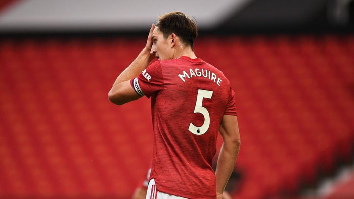 MANCHESTER, ENGLAND - OCTOBER 04: Harry Maguire of Manchester United reacts during the Premier League match between Manchester United and Tottenham Hotspur at Old Trafford on October 04, 2020 in Manchester, England. Sporting stadiums around the UK remain under strict restrictions due to the Coronavirus Pandemic as Government social distancing laws prohibit fans inside venues resulting in games being played behind closed doors. (Photo by Oli Scarff - Pool/Getty Images)