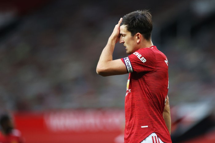 MANCHESTER, ENGLAND - OCTOBER 04: Harry Maguire of Manchester United reacts during the Premier League match between Manchester United and Tottenham Hotspur at Old Trafford on October 04, 2020 in Manchester, England. Sporting stadiums around the UK remain under strict restrictions due to the Coronavirus Pandemic as Government social distancing laws prohibit fans inside venues resulting in games being played behind closed doors. (Photo by Carl Recine - Pool/Getty Images)