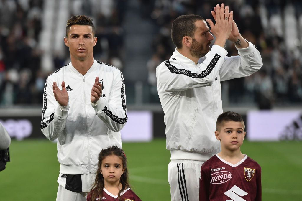 TURIN, ITALY - JULY 20:  Cristiano Ronaldo (R) of Juventus celebrates the victory with team mate Leonardo Bonucci at the end of the Serie A match between Juventus and  SS Lazio at Allianz Stadium on July 20, 2020 in Turin, Italy.  (Photo by Valerio Pennicino/Getty Images)
