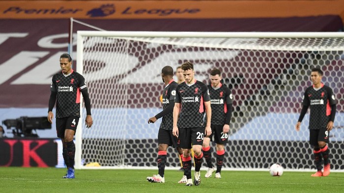 Liverpool players react after Aston Villas Ollie Watkins scores his sides fourth goal during the English Premier League soccer match between Aston Villa and Liverpool at the Villa Park stadium in Birmingham, England, Sunday, Oct. 4, 2020. (Peter Powell/Pool via AP)