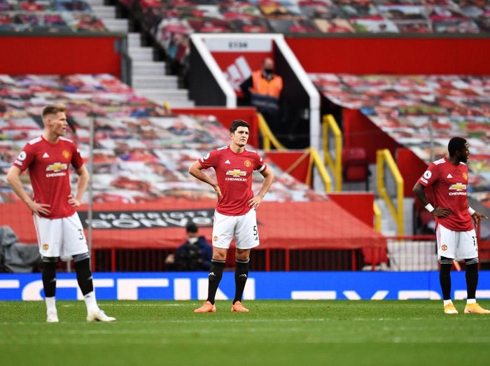 MANCHESTER, ENGLAND - OCTOBER 04: Harry Maguire of Manchester United looks dejected during the Premier League match between Manchester United and Tottenham Hotspur at Old Trafford on October 04, 2020 in Manchester, England. Sporting stadiums around the UK remain under strict restrictions due to the Coronavirus Pandemic as Government social distancing laws prohibit fans inside venues resulting in games being played behind closed doors. (Photo by Oli Scarff - Pool/Getty Images)