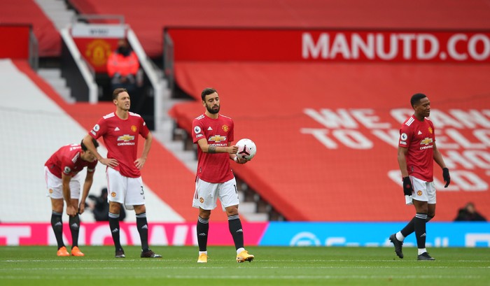 MANCHESTER, ENGLAND - OCTOBER 04: Bruno Fernandes of Manchester United reacts after Tottenham Hotspur score their first goal during the Premier League match between Manchester United and Tottenham Hotspur at Old Trafford on October 04, 2020 in Manchester, England. Sporting stadiums around the UK remain under strict restrictions due to the Coronavirus Pandemic as Government social distancing laws prohibit fans inside venues resulting in games being played behind closed doors. (Photo by Alex Livesey/Getty Images)