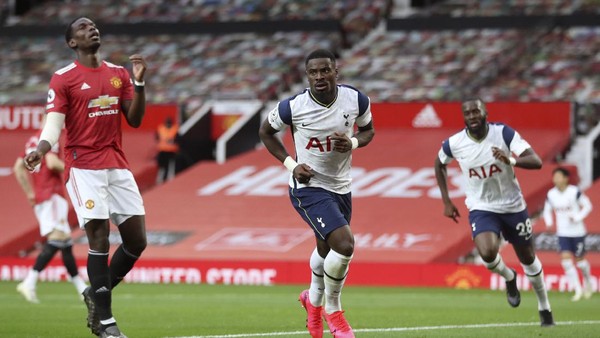 Tottenhams Serge Aurier, center, celebrates after scoring his sides fifth goal during the English Premier League soccer match between Manchester United and Tottenham Hotspur at Old Trafford in Manchester, England, Sunday, Oct. 4, 2020. (Carl Recine/Pool via AP)