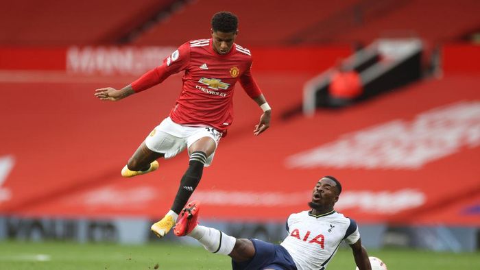 Marcus Rashford MANCHESTER, ENGLAND - OCTOBER 04: Marcus Rashford of Manchester United battles for possession with Serge Aurier of Tottenham Hotspur during the Premier League match between Manchester United and Tottenham Hotspur at Old Trafford on October 04, 2020 in Manchester, England. Sporting stadiums around the UK remain under strict restrictions due to the Coronavirus Pandemic as Government social distancing laws prohibit fans inside venues resulting in games being played behind closed doors. (Photo by Carl Recine - Pool/Getty Images)