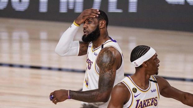 Los Angeles Lakers' LeBron James (23) reacts after getting fouled against the Miami Heat during the first half in Game 3 of basketball's NBA Finals, Sunday, Oct. 4, 2020, in Lake Buena Vista, Fla. (AP Photo/Mark J. Terrill)