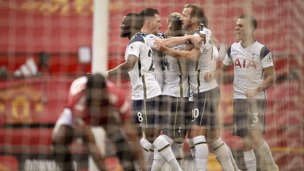 Tottenham players celebrate after scoring their first goal during the English Premier League soccer match between Manchester United and Tottenham Hotspur at Old Trafford in Manchester, England, Sunday, Oct. 4, 2020. (Oli Scarff/Pool via AP)