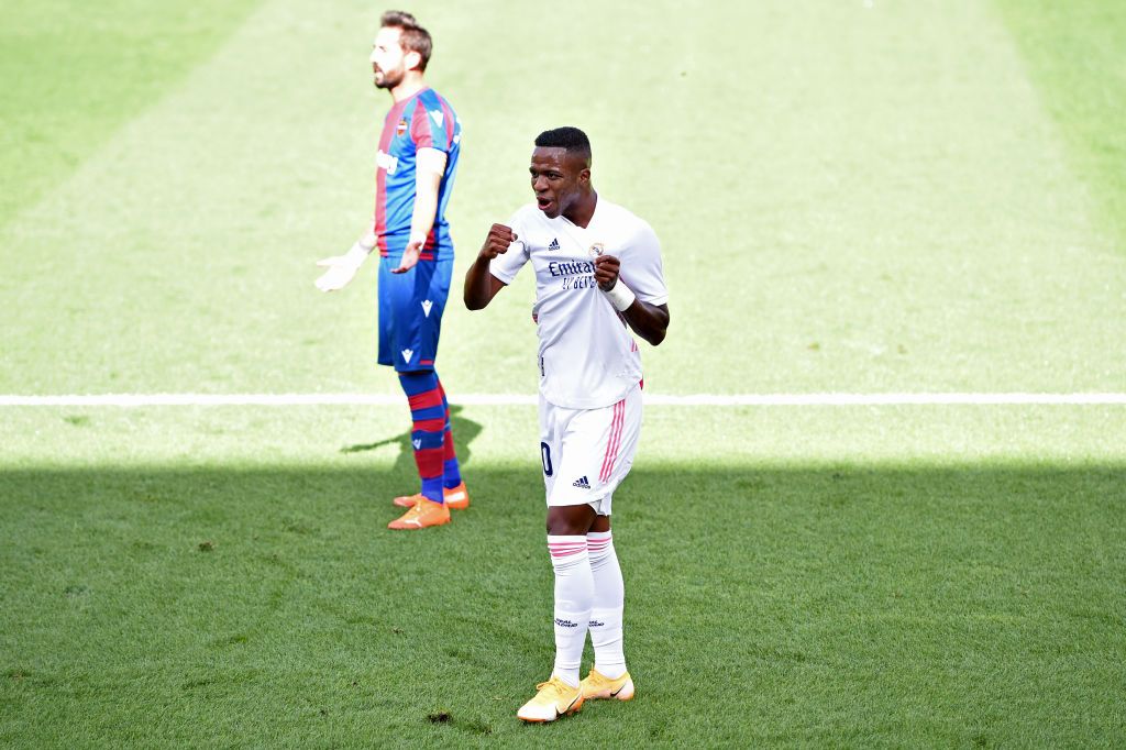 VILLAREAL, SPAIN - OCTOBER 04: Vinicius Junior of Real Madrid celebrates after he scores his sides first goal during the La Liga Santander match between Levante UD and Real Madrid at Ciutat de Valencia Stadium on October 04, 2020 in Valencia, Spain. Football Stadiums around Europe remain empty due to the Coronavirus Pandemic as Government social distancing laws prohibit fans inside venues resulting in fixtures being played behind closed doors. (Photo by Alex Caparros/Getty Images)