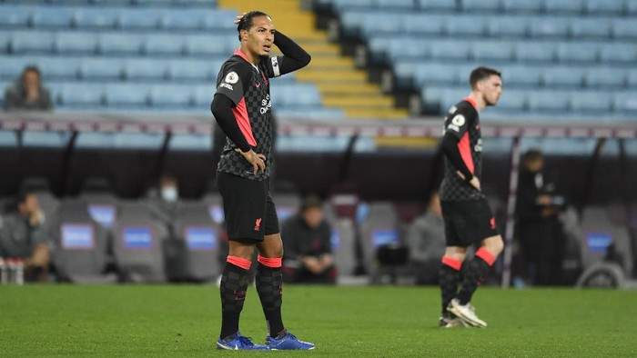 BIRMINGHAM, ENGLAND - OCTOBER 04: Virgil van Dijk of Liverpool reacts after Aston Villa score their 7th goal during the Premier League match between Aston Villa and Liverpool at Villa Park on October 04, 2020 in Birmingham, England. Sporting stadiums around the UK remain under strict restrictions due to the Coronavirus Pandemic as Government social distancing laws prohibit fans inside venues resulting in games being played behind closed doors. (Photo by Peter Powell - Pool/Getty Images)