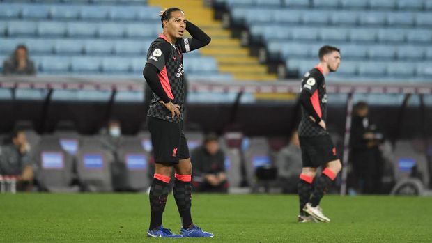 BIRMINGHAM, ENGLAND - OCTOBER 4: Virgil van Dijk of Liverpool reacts after Aston Villa scored his seventh goal during the Premier League match between Aston Villa and Liverpool at Villa Park on October 4, 2020 in Birmingham, England.  Sports stadiums across the UK remain under strict restrictions due to the coronavirus pandemic, as the government's social distancing laws prohibit fans within venues, causing games to be played behind closed doors.  (Photo by Peter Powell - Pool / Getty Images)