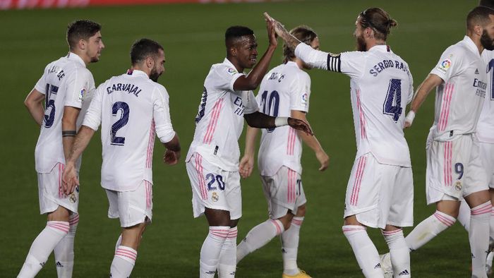 Real Madrid Real Madrids Vinicius Junior, center, celebrates with his teammates after scoring during the Spanish La Liga soccer match between Real Madrid and Valladolid at Alfredo di Stefano stadium in Madrid, Spain, Wednesday, Sept. 30, 2020. (AP Photo/Manu Fernandez)