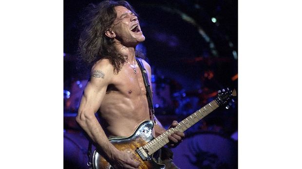 FILE - In this Aug. 5, 2004 file photo, Van Halen guitarist Eddie Van Halen performs in Phoenix. Van Halen, who had battled cancer, died Tuesday, Oct. 6, 2020. He was 65. (AP Photo/Tom Hood, File)