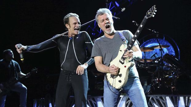 FILE - David Lee Roth, left, and Eddie Van Halen of Van Halen perform in Wantagh, N.Y. on Aug. 13, 2015. Van Halen, who had battled cancer, died Tuesday, Oct. 6, 2020. He was 65. (Photo by Greg Allen/Invision/AP, File)