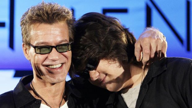FILE - Eddie Van Halen, left, embraces his son Wolfgang Van Halen after the rock group Van Halen officially announced their North American tour during a news conference in Los Angeles on Aug. 13, 2007. Eddie Van Halen, who had battled cancer, died Tuesday, Oct. 6, 2020. He was 65. (AP Photo/Kevork Djansezian, File)